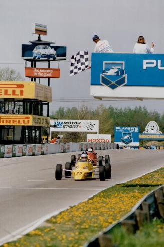 On track: One dirver gets that caged-in feeling at Mosport while Marshall Nelson of Mississauga, right, takes his Formula 1600 machine for qualifying spin