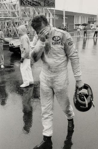 Oh, No! Jeff Wood walks away dejectedly after his car gave up at Turn 5