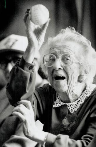A pitch for the Jays. Phyllis Eagleson, 90, tries her arm yesterday as about 60 chronic care patients at the Queen Elizabeth Hospital in Parkdale offi(...)