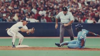 Not even close: Jays third baseman Kelly Gruber has all day to put the tag on Kansas City's Bo Jackson, who was thrown out trying to steal third