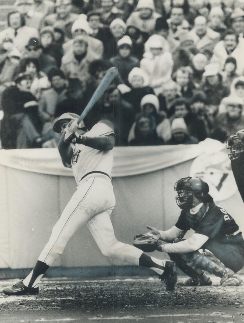 Vintage photo of Blue Jays player swinging in front of crowd