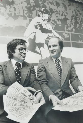 Winding up to promote Toronto Blue Jays are newly arrived marketing vice-president Ron Millichamp (right) and Paul Beeston, administrative chief, Mura(...)
