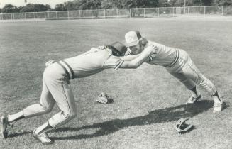 Fitness is as much a part of spring training as baseball and here, Bob Bailor, left, and Roy Howell work on strength