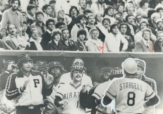 Guess who won? There isn't a smile on the face of any Montreal Expo's fan as they watch Willie Stargell being greeted by Pittsburgh Pirate teammates i(...)