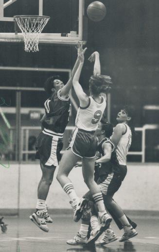 Soviet blocked: Canada's Lori Clarke gets a hand up to block an attempted shot by the Soviet Union's Marina Burmistrova in an exhibition basketball match at Varsity Arena