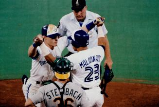Welcome home: kelly Gruber is greeted by Candy Maldonado at home plate after Gruber homered to left field in the fifth Inning, putting Jays up 2-0
