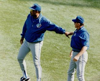 Let's not get in any more trouble than we are,' manager cito Gaston says as he restrains bench coach Gene Tenace from running on to the field