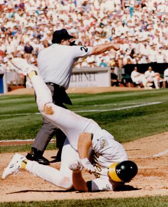 In your face,' Says Pat Borders as McGwire tries to bowl him over at the plate in key play of the game