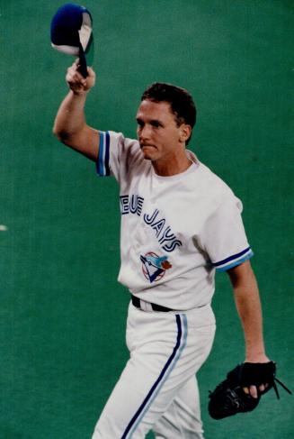 Hats off to jay fans: Pitcher David Cone doffs his cap to the SkyDome faithful after he pitched a strong eight-plus innings against Oakland last night