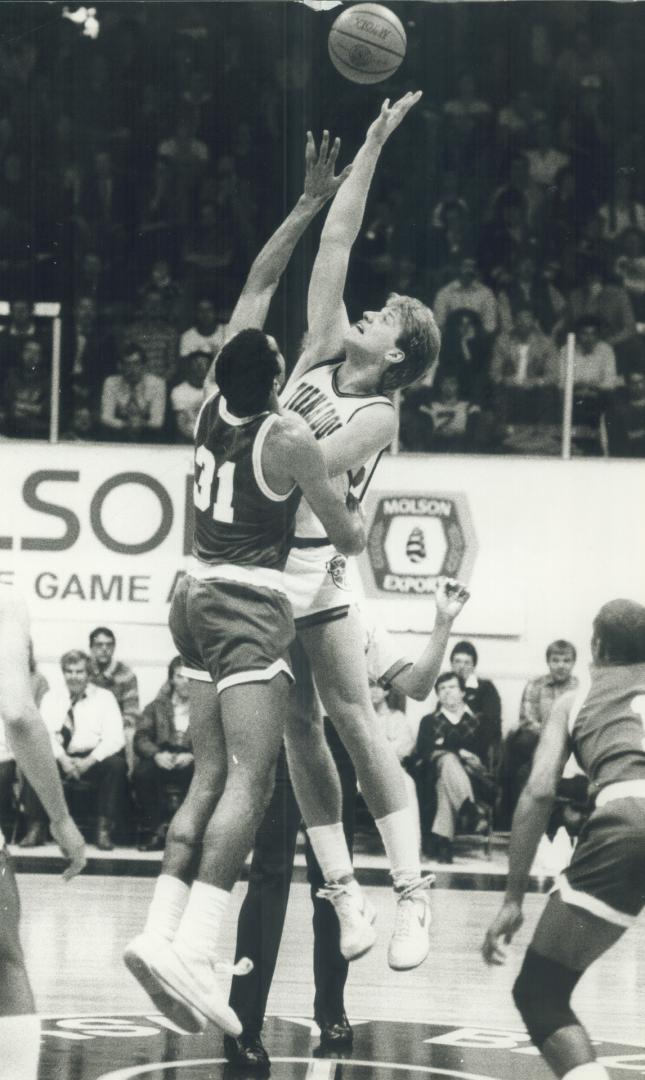 Toronto Tornados centre Paul Brozovich reaches high to tip ball away from Penny Elliott of Albany Patroons but Albany went on to win 123-111. Tornados' loss evens five-game playoff series at two