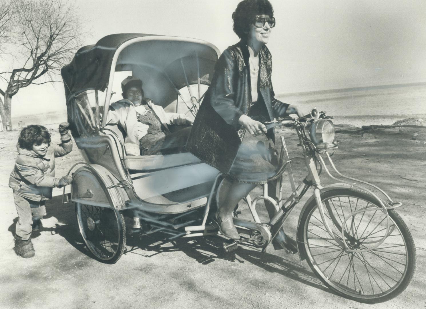 On a bicycle built for...three. Envious eyes and crowds of curious youngsters followed Eileen Abrams along boardwalk on the Beaches yesterday as she w(...)