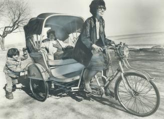 On a bicycle built for...three. Envious eyes and crowds of curious youngsters followed Eileen Abrams along boardwalk on the Beaches yesterday as she w(...)