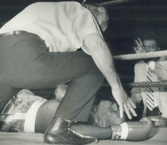 Say goodnight, Mr. Hatcher, Referee Ed Gaudet counts out Tyrone Hatcher, who was laid out cold by Dwith Frazer in the main event of a pro boxing card (...)
