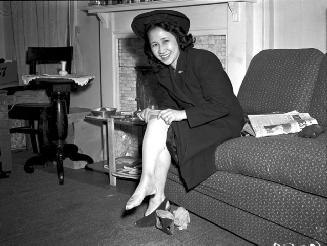 War bride trying on stockings