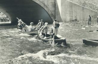 There was rough water ahead. Anything goes at the Twelve Mile Creek annual canoe race and that included running through shallow water to pull your can(...)