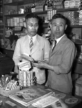 Variety store owners or workers