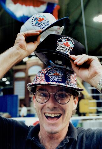 Your choice: Vendor Roger Bullock shows off some All-Star hats FanFest visitors can pick up