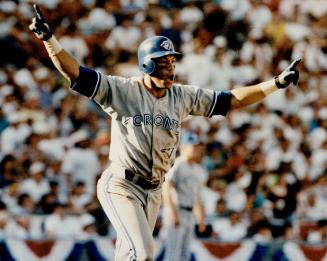 Jumping for Joy, Robbie Alomar leaves the plate after smashing homer that tied the game