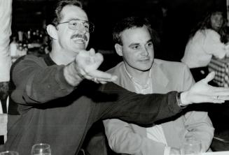 Ya gotta hand it to 'em: Veterans Rance Mullilniks and Jimmy Key relax at a downtown restaurant after the Jays' division-clinching win yesterday over Detroit