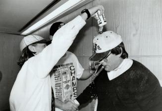 Beeston Brew: Jays president Paul Beeston, despite his own best efforts, couldn't avoid being crowned by a victory beer in the tumult of the Jays locker room