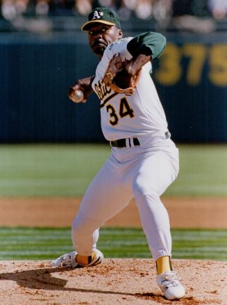 Left: Dave Stewart uses his death stare and a wicked forkball to silence the Jays in game 5