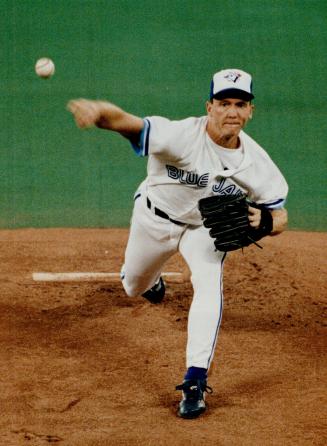 Fire away: Jays starter David Cone, faced with a must-win situation, bears down in the early innings of last night's ALCS game against the Oakland A's at the SkyDome