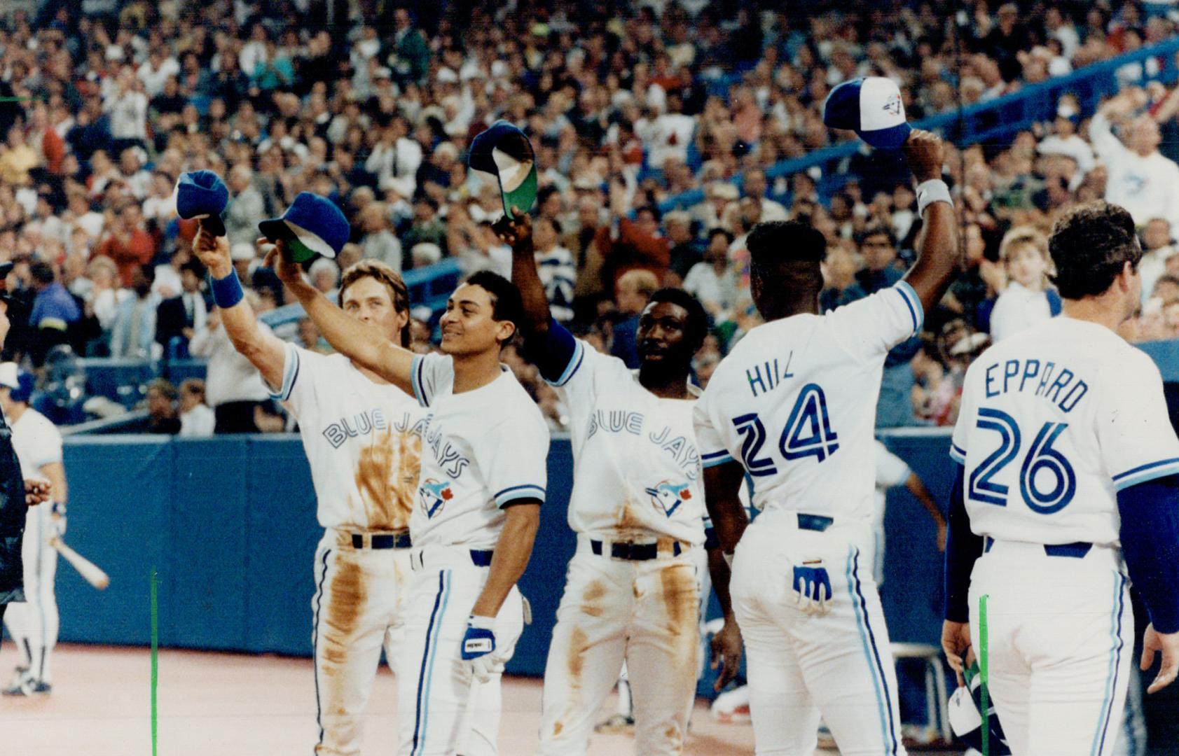 Hats off: Blue Jays Kelly Gruber, Junior Felix, Mookie Wilson and Glenalien  Hill tip their caps to fans last night as a major league attendance record  of 3,635,829 was set – All