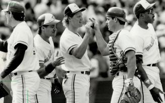 Winners: From left, Pat Borders, Pat Tabler, Ed Sprague and Dave Winfield celebrate Jays win over the Twins