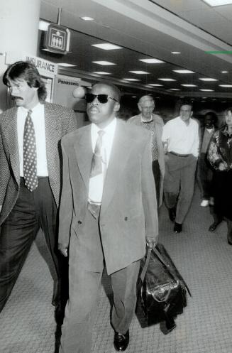 A's arrival: Dennis Eckersley, left, and Jerry Browne arrive at Pearson airport yesterday