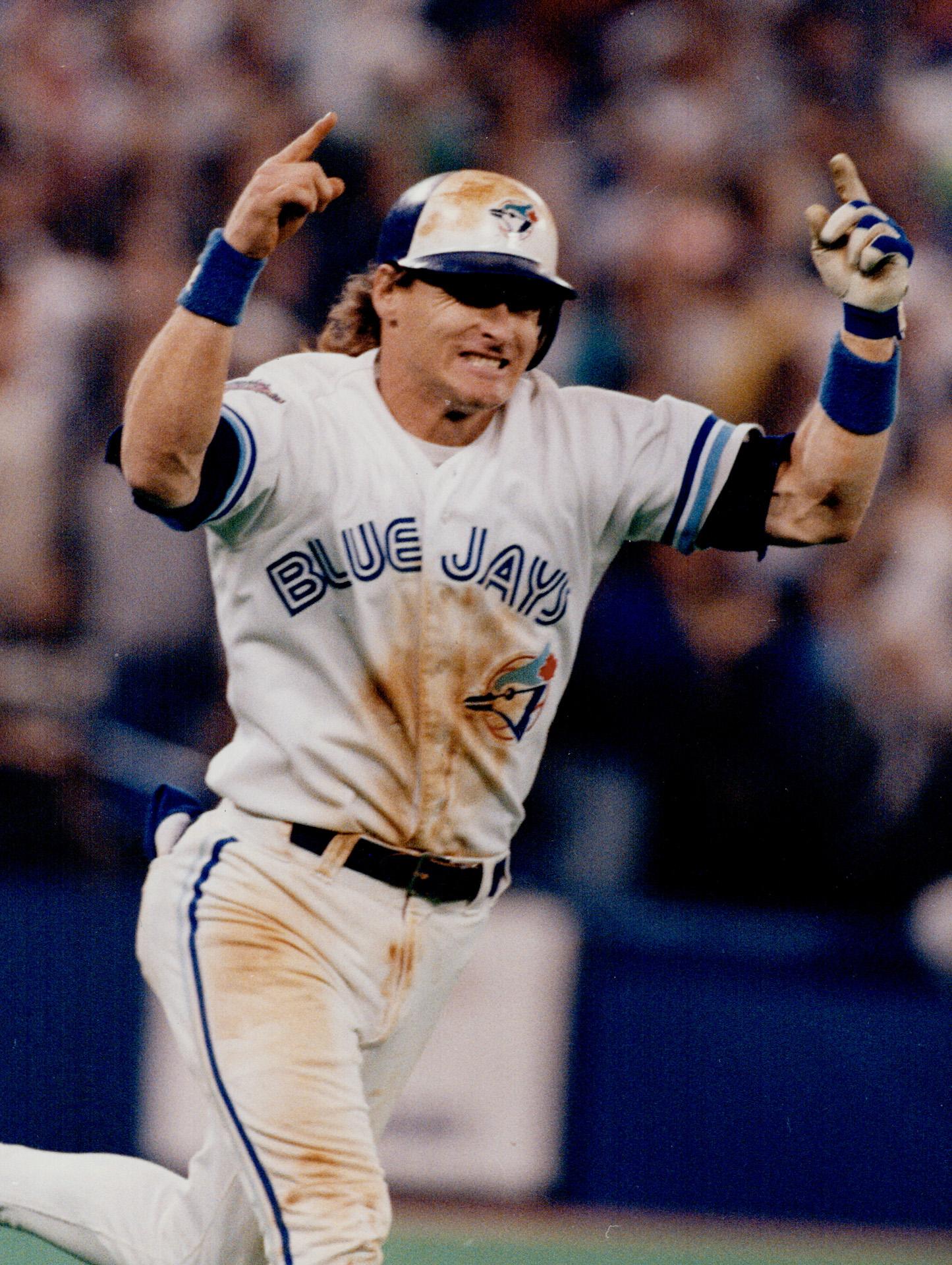 Blue Jays' third baseman Kelly Gruber gives his 1-year-old son, Kody, a few  hints on batting yesterday at the SkyDome, during a pre-game event for  the() – All Items – Digital Archive 