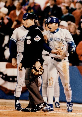 Apoplectic Alomar goes after Mike Reilley after the UMP blew a call on the sliding Jay at home plate