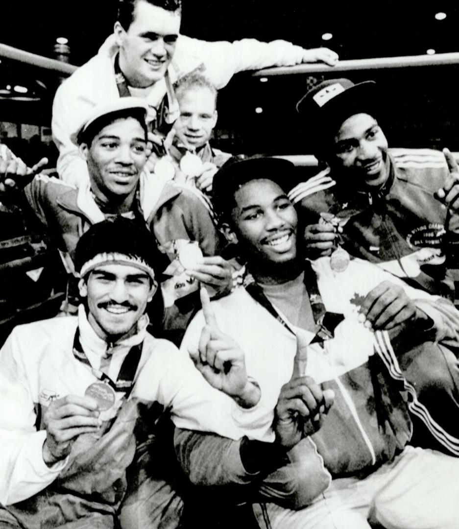 Canada's six gold medallists from the boxing competition team-up after completion of their events tonight