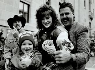Thumbs up: Pitcher Mark Elchhorn, his wife, Mariann, and son, Brian, celebrate with Jack Morris, left, during yesterday's parade