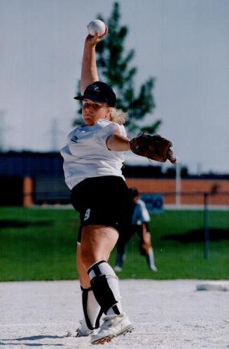 Newmarket hurier Carrie Anne Fildey winds up to unleash a high hard one in softball action at Ontario Games in Scarborough. Newmarket lost to Waterloo, the eventual bronze medal winner