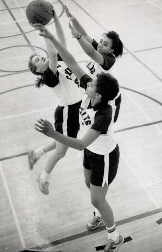 Lonely practice: Three of only ten players on the Centennial College team are Deborah Fullerton, making the shot, Nicky Smith (foreground) and Arlene Chin