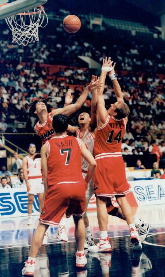 J. D. Jackson (facing) and Steve Wash (7), Greg Wiltjgr (14) Canada