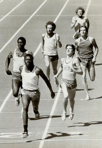 Warm up track meet. Samson Obwocha wins from Paul Forbes of Scotland and Clyde Edwards of Barbados (right) Obwocha is from Kenya
