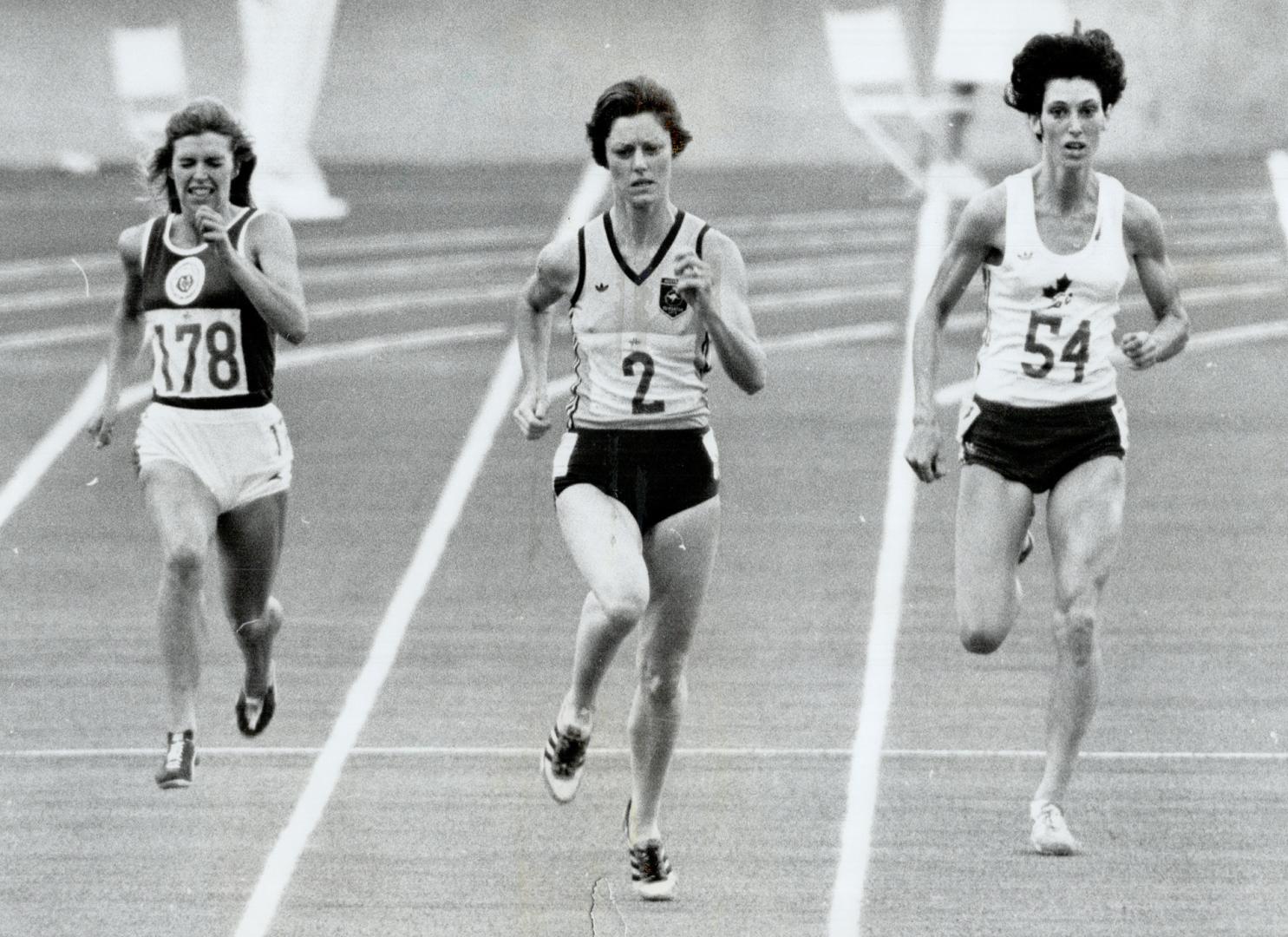 Women 200 metre final. Denise Boyd (2) of Australia wins in 22.82. She is flanked by Helen Golden (178) of Scotland (6th) and Patty Loverock ($54) of Canada (7th)