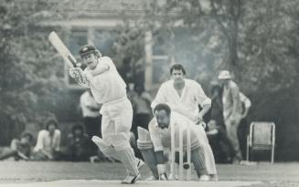 Full-blooded stroke is taken by Greg Chappell of Australian Test cricket team in Saturday's match against eastern Canada team at Toronto Cricket, Curl(...)