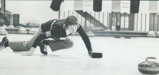 Showing intense concentration, Neale McQuiston of Scotland sends rock skimming down the ice during Uniroyal world junior curling championship at East (...)