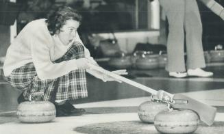 Her face etched with concentration, Joan McAlpine, skip of Granite Club rink, lines up shot for teammate during Toronto Cricket, Skating and Curling C(...)