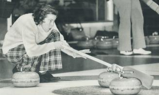Her face etched with concentration, Joan McAlpine, skip of Granite Club rink, lines up shot for teammate during Toronto Cricket, Skating and Curling C(...)