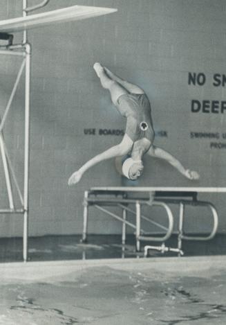 Perfect form is shown by Judy Stewart, 19, silver medalist