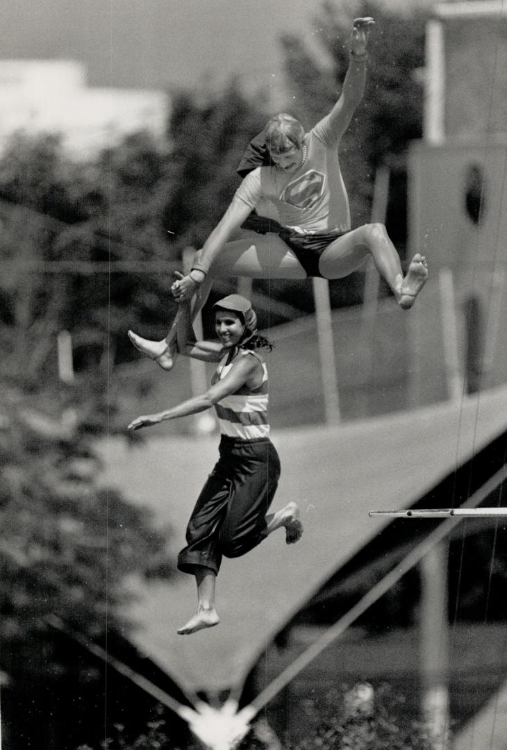 U.S. high divers go off deep end at Ontario Place. Two divers, above, clown around yesterday at Ontario Place, while a third takes the plunge from the(...)