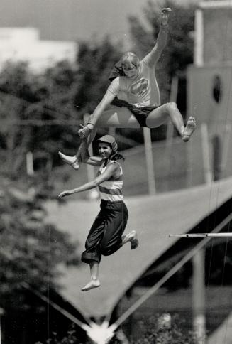 U.S. high divers go off deep end at Ontario Place. Two divers, above, clown around yesterday at Ontario Place, while a third takes the plunge from the(...)