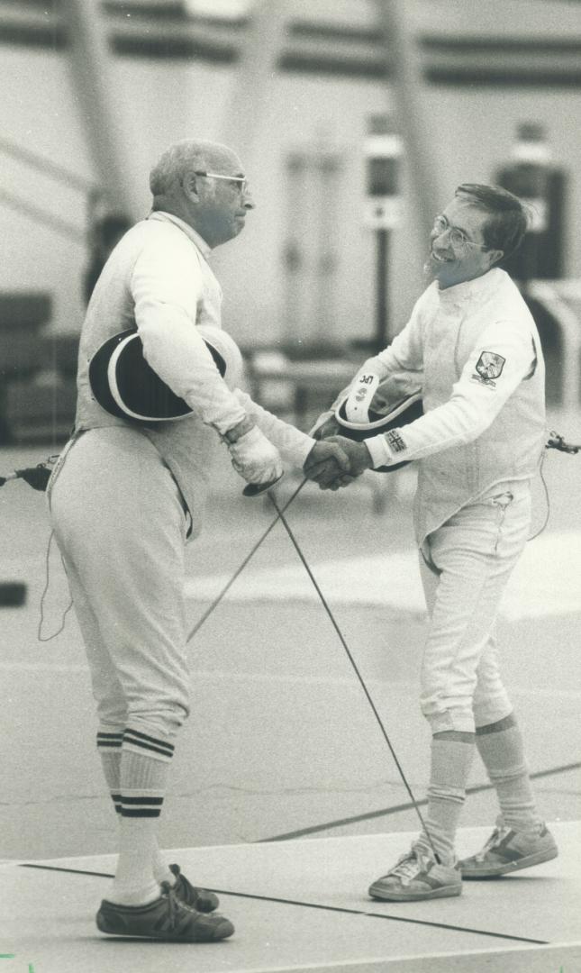 Foiled again! A hit is registered by leonard Camin under the arm of American opponent Art Plouffe during the preliminaries of the foil competition at (...)