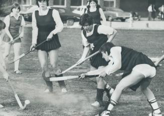 Preparing for a tournament. The girls' field hockey team from Pickering High School, 1974-75 Central Ontario champions, yesterday defeated R. S. McLau(...)