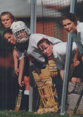 Holding on: Thomson goalie Jamie Volikis waits for shot with teammates during Scarborough high school field hockey game against Leacock