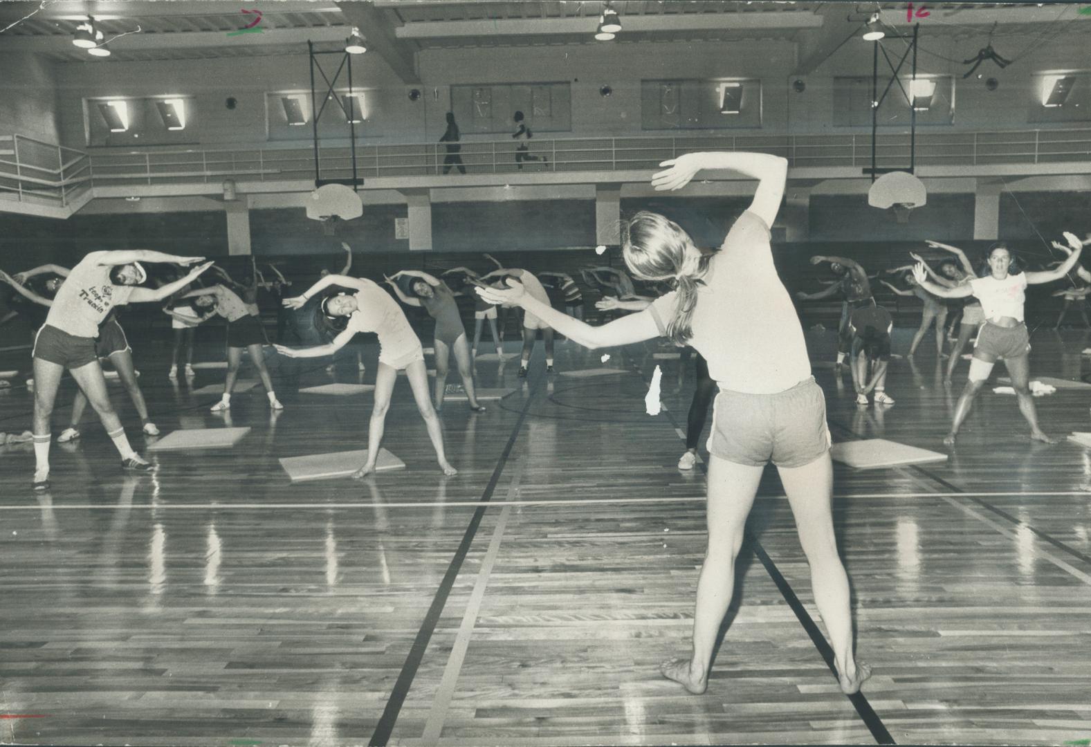 Fitness appraisal is Leslie Michener's forte and supervising the daily co-edcational fitness classes is one of her duties at the YMHA. Here she leads (...)