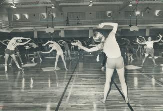 Fitness appraisal is Leslie Michener's forte and supervising the daily co-edcational fitness classes is one of her duties at the YMHA. Here she leads (...)